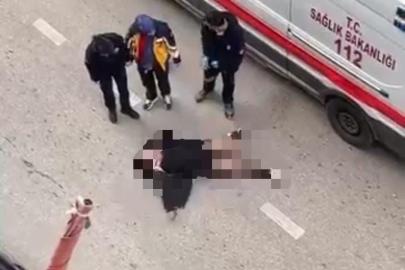 Yolun ortasında yatan kadın, sinir krizi geçirdi