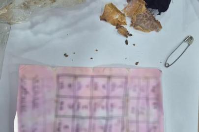 Bolu’da yapı marketin raflarının arasında muska çıktı: "Büyücülerin şerrinden Allah’a sığınırım"