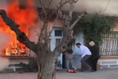 Kedisini kurtarmak için alevlerin içine daldı; komşuları güçlükle dışarı çıkardı