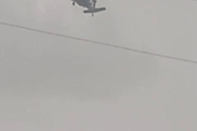 Askeri helikopter dolu ve yağmura yakalandı